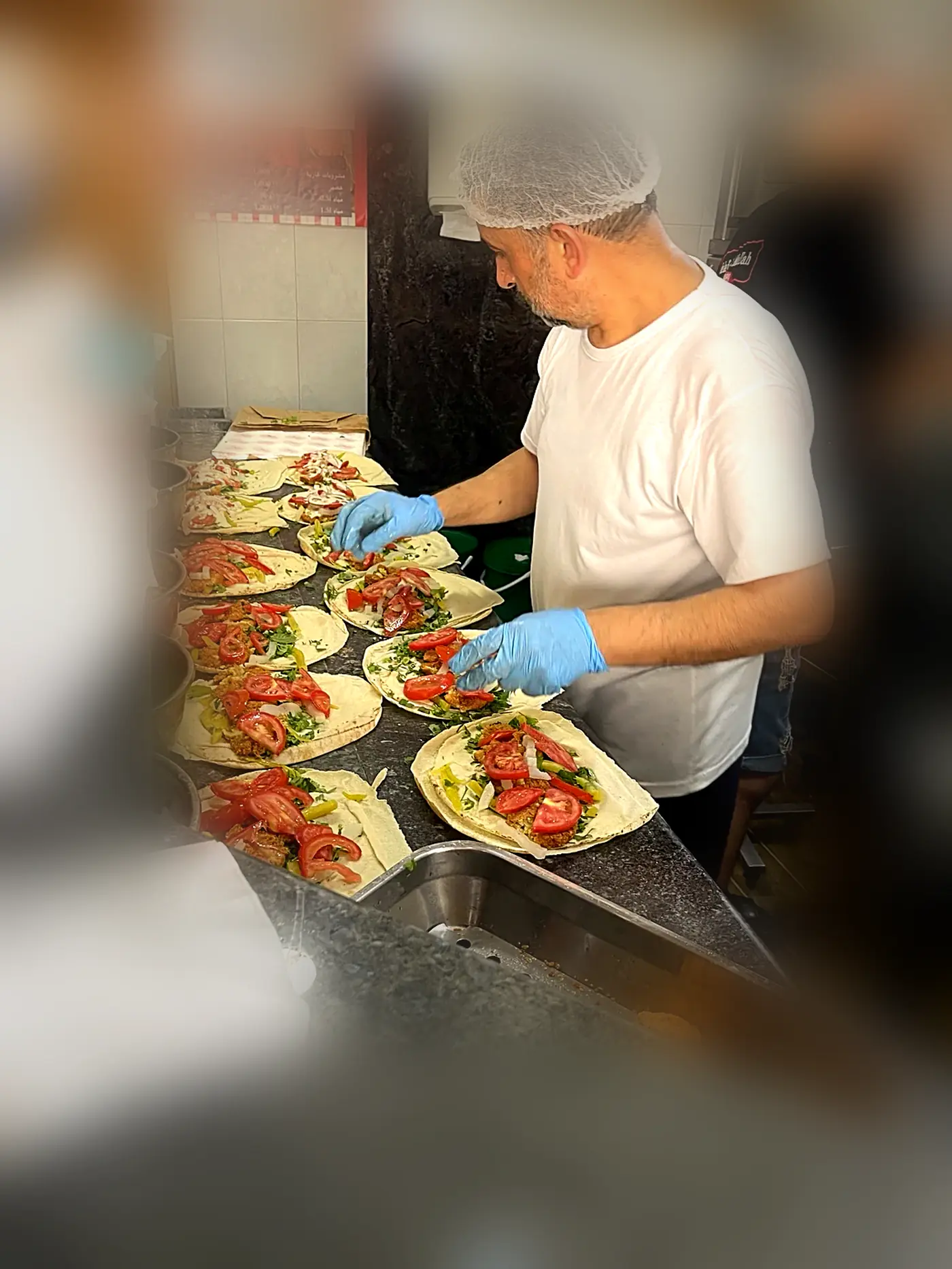 Sandwiches being assembled to order behind the counter